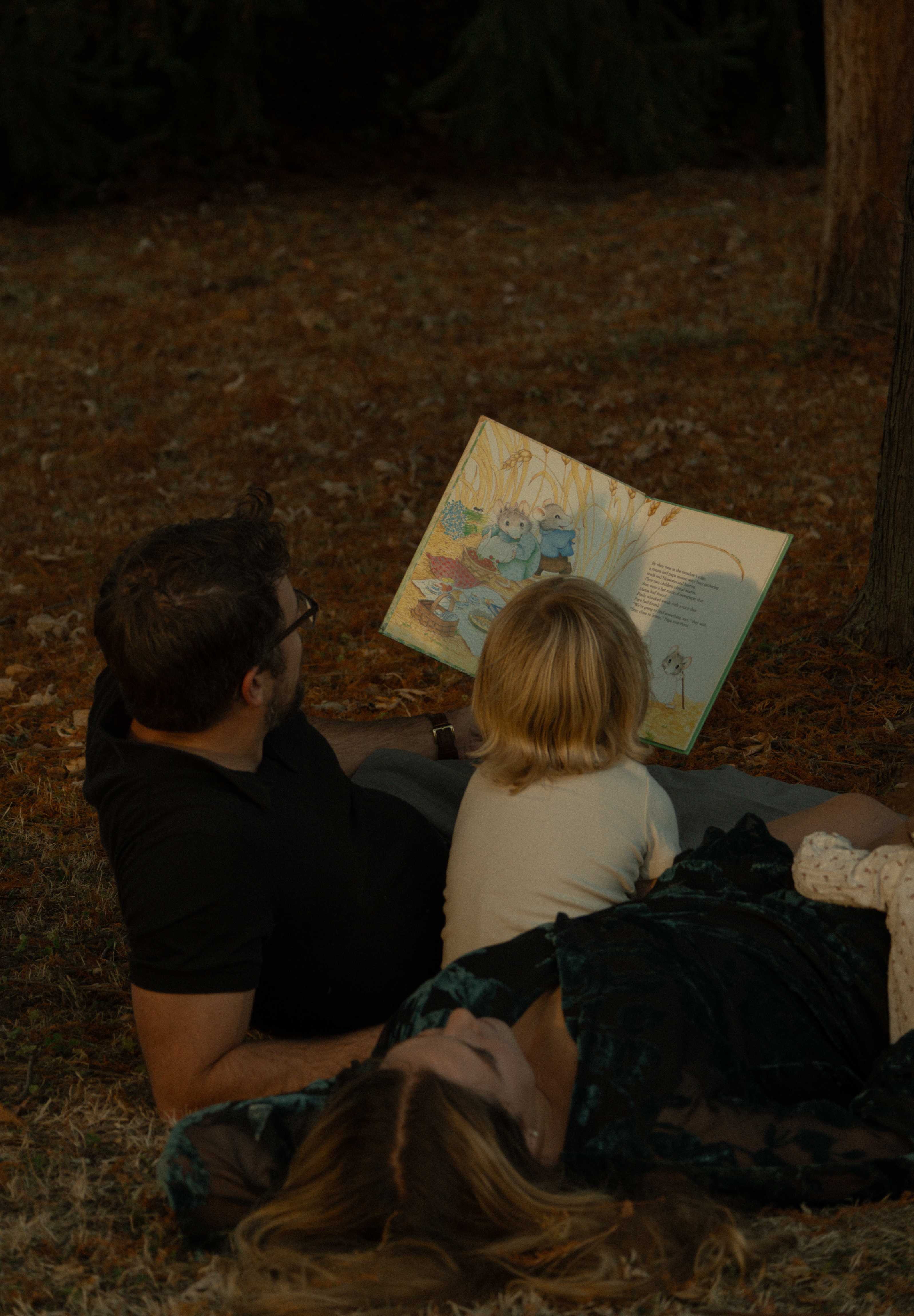 Isaiah Grant, video producer, reading with his son
